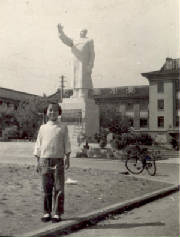 In front of a Mao statue 